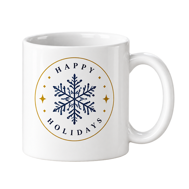 White mug with a navy snowflake inside a gold circle and the words Happy Holidays around it.