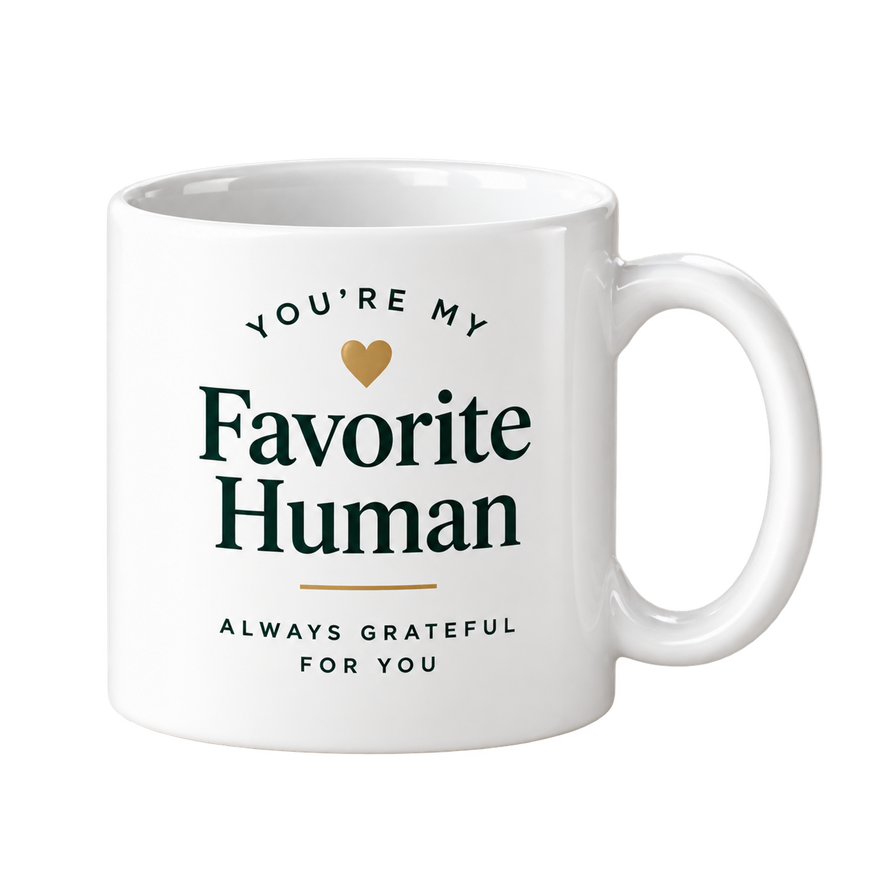 White mug with the words You’re My Favorite Human in dark green and a small gold heart.
